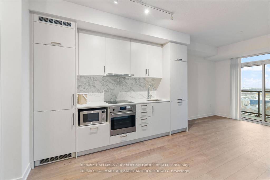Discover modern living at Mobilio Condos with this stylish 1 bed Den condo available for lease.