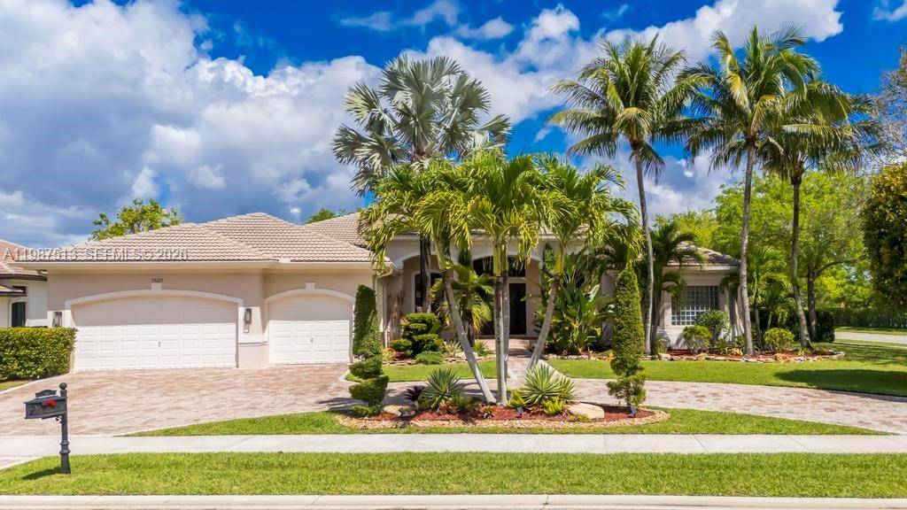 Stunning lakefront home located in the exclusive guard gated community of Riverstone in West Davie.