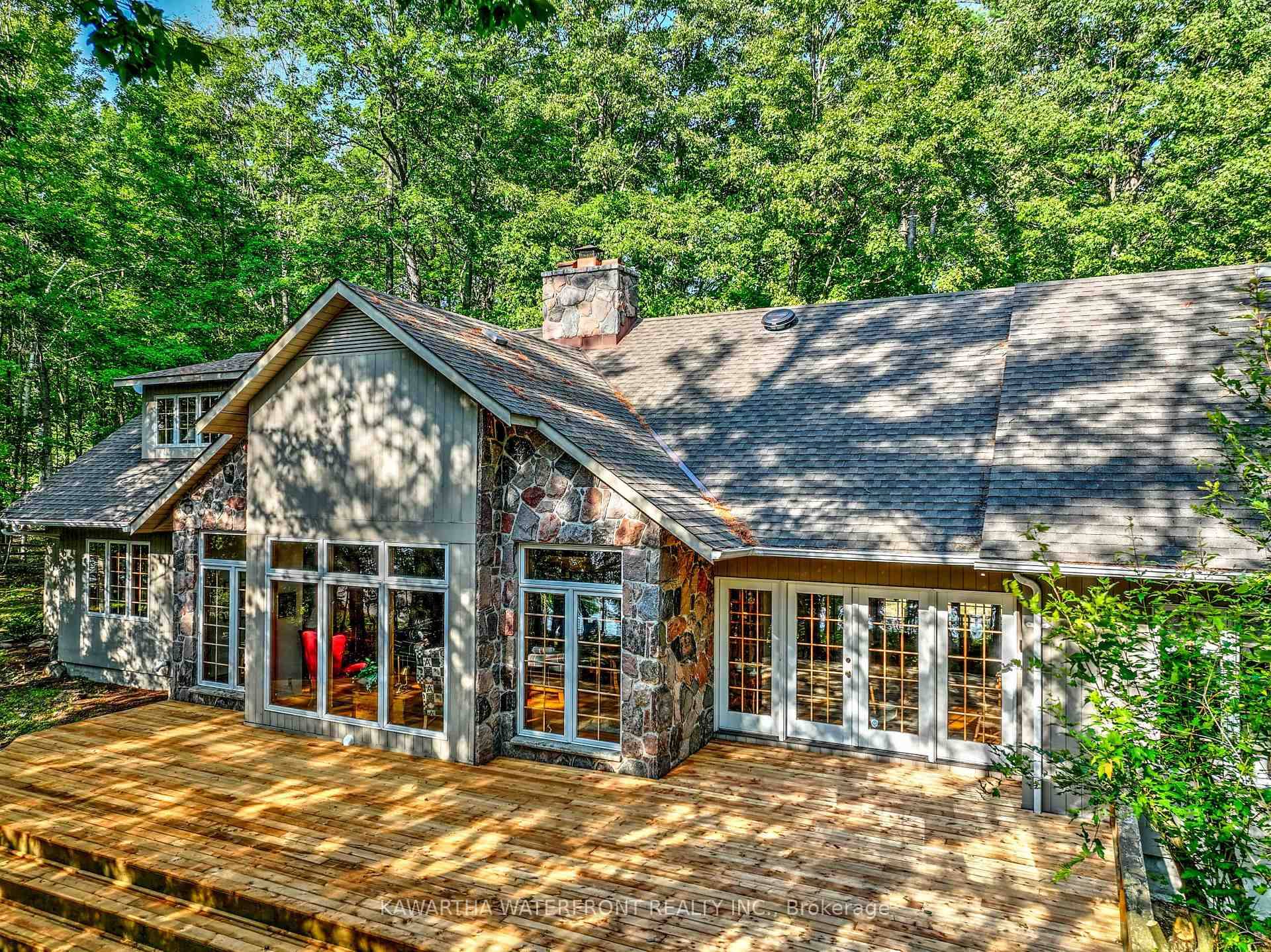 This Lake House on coveted Indian Point on Balsam Lake provides immense and priceless privacy across its 200 ft of waterfront and 2.