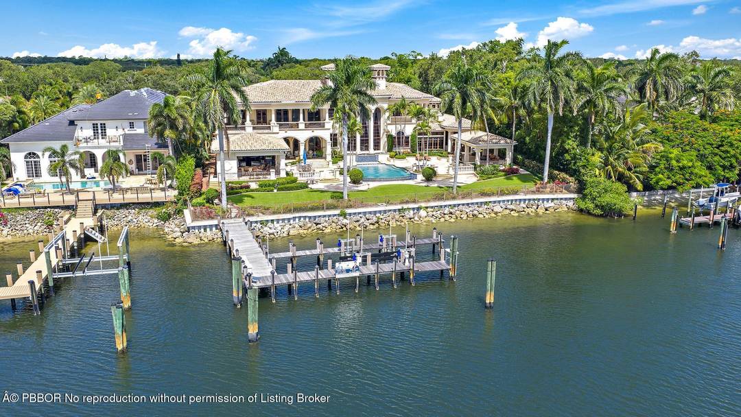 Experience the ultimate in luxury living at this exceptional Palm Beach Gardens waterfront estate.