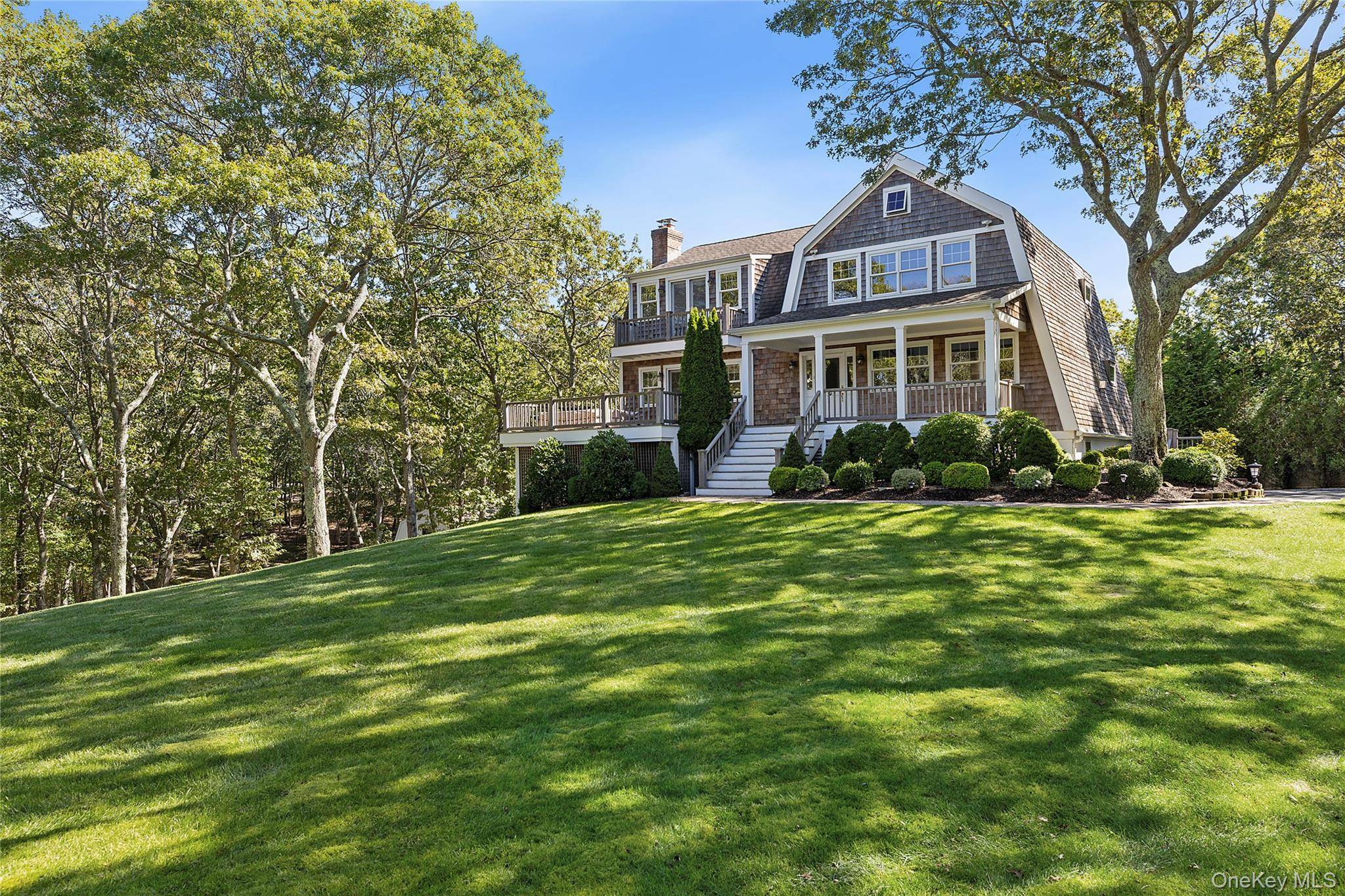 Welcome to 22 Old Trail Road, a charming beach cottage style residence of 4 bedrooms plus den and 3.