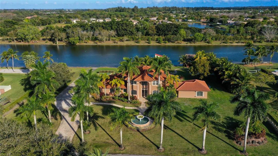 Experience resort style lakefront living in the exclusive gated community of Lago Del Sol.