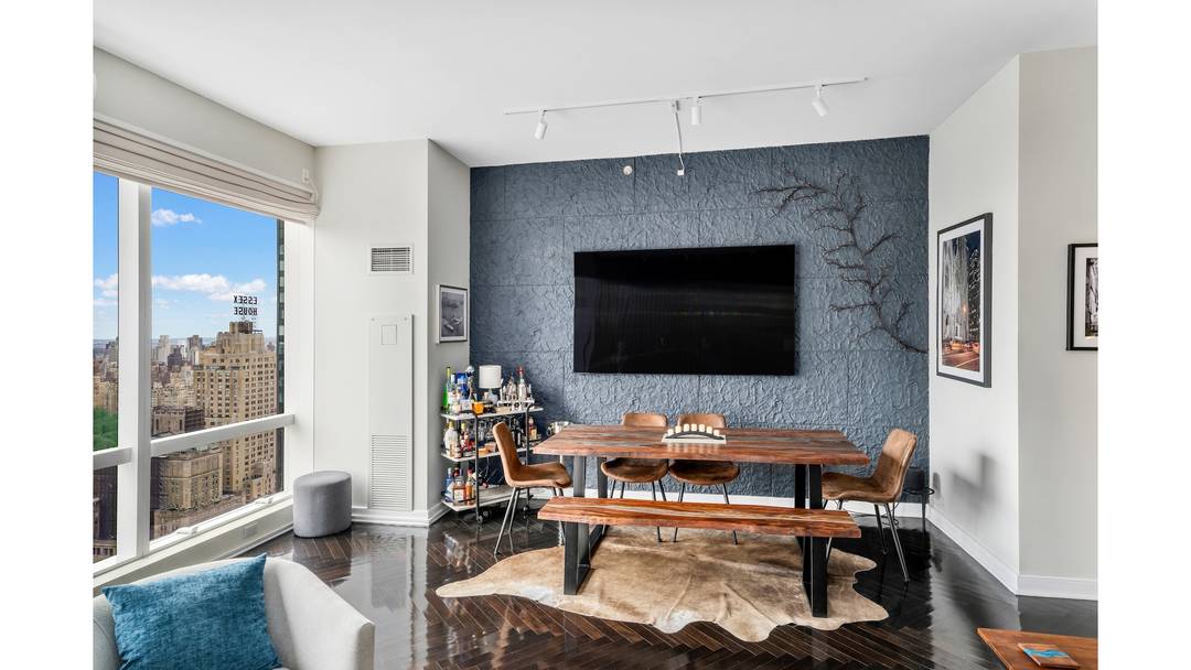 Experience breathtaking views of Central Park and the Hudson River from this stunning corner residence that spans 1, 420 sq ft.