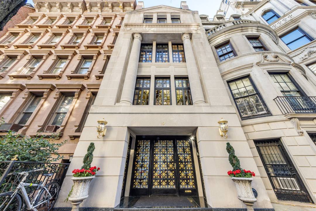 Grand and lavish, this limestone townhouse, on a highly coveted block known for its magnificent residences, is truly unparalleled.