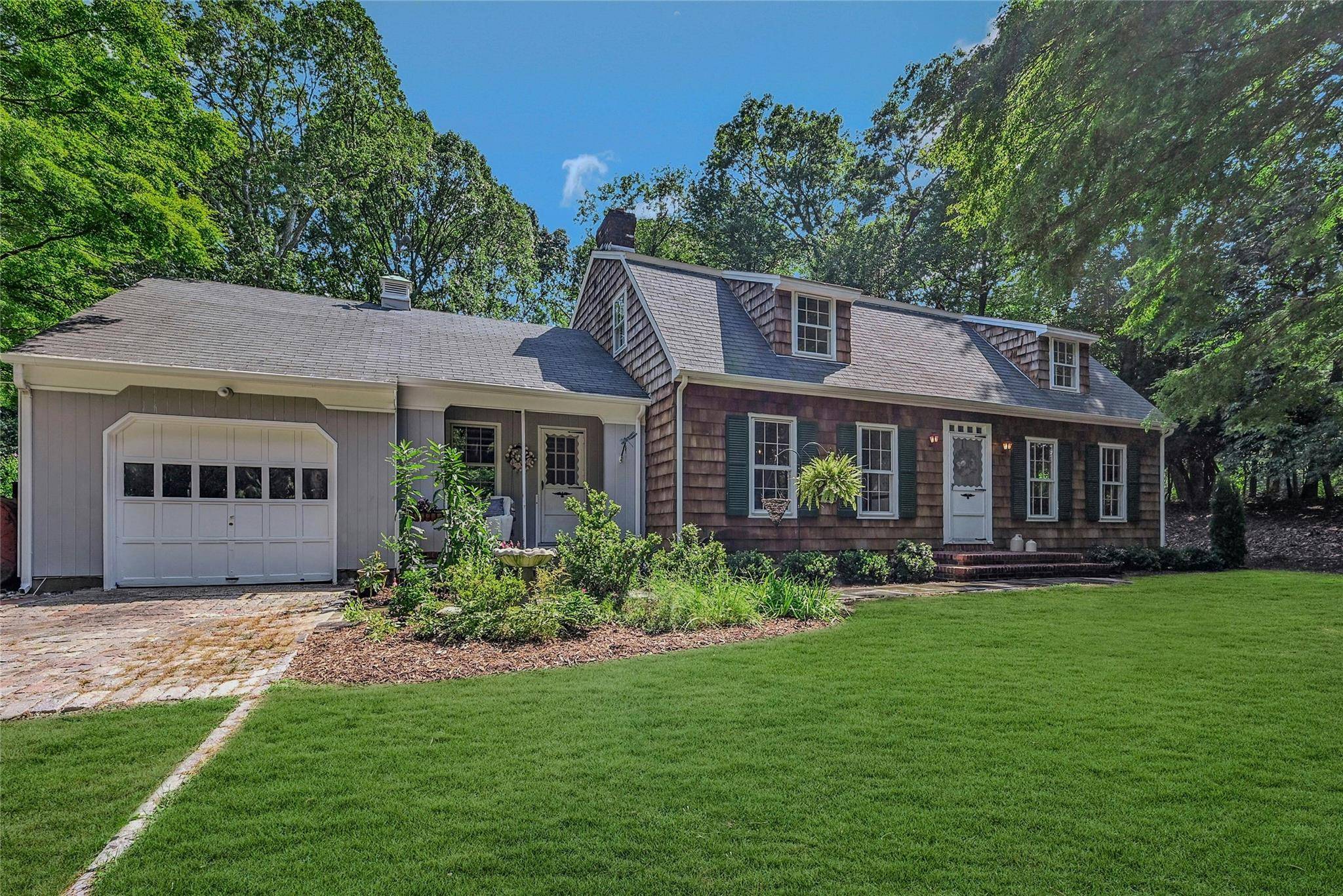 Welcome to 3 Nadia Court, a timeless New England style Cape nestled on nearly 2.