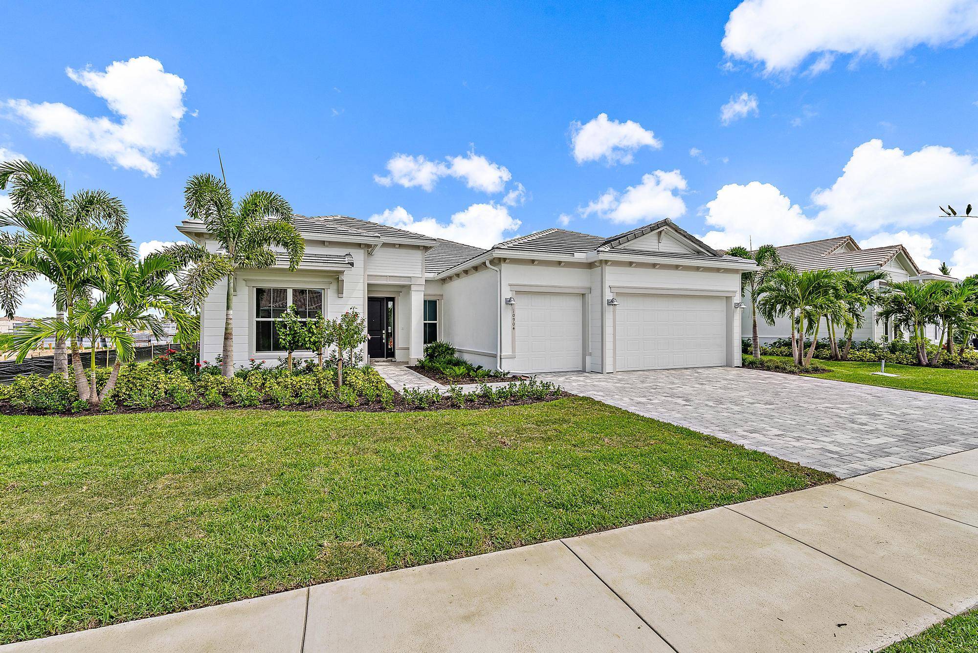 Welcome to the epitome of modern luxury living in the prestigious Avondale neighborhood at Avenir, Palm Beach Gardens.