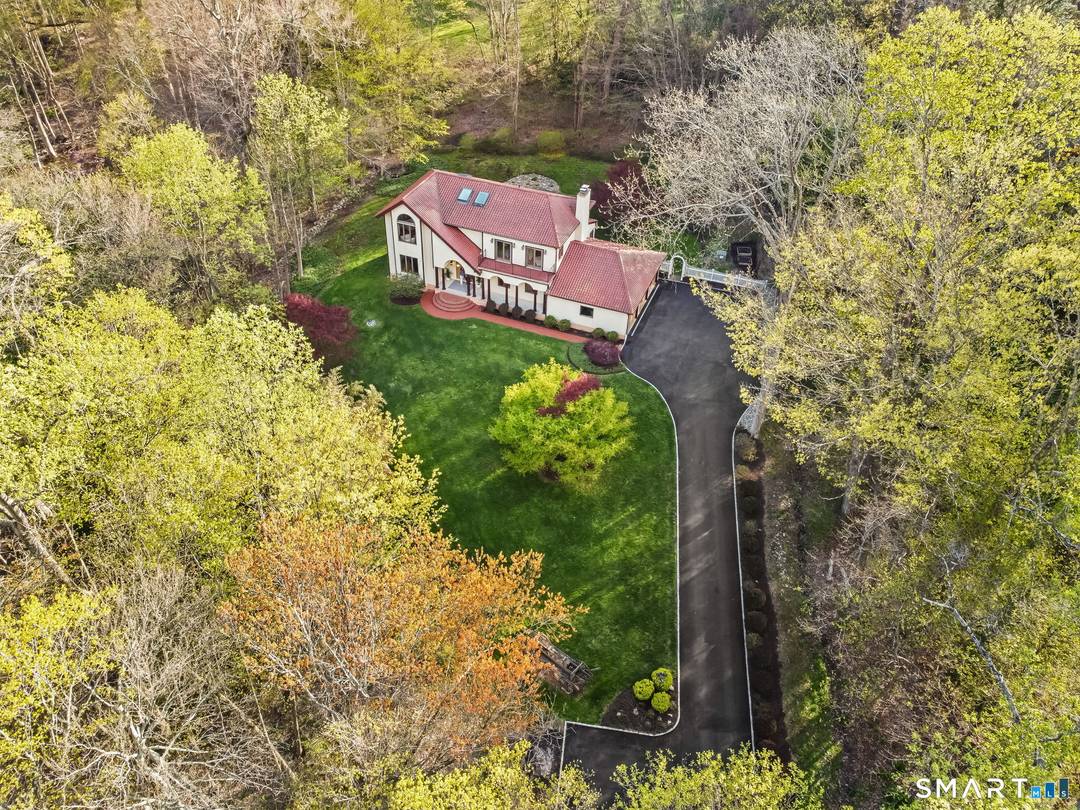 Set gracefully back from the road on an oversized 2.