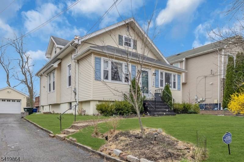Step into this bright, light filled custom Cape Cod, featuring an open and inviting first level with high ceilings, designed for comfortable living.
