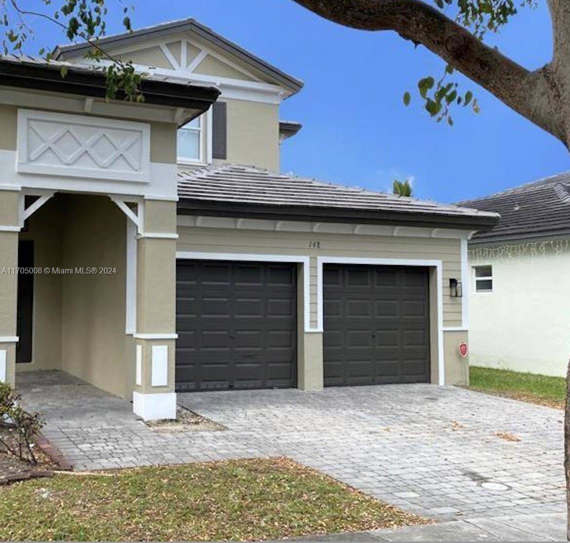 Tastefully updated two story lakefront home inside this desirable huge gated community called Isles of Oasis in Homestead.