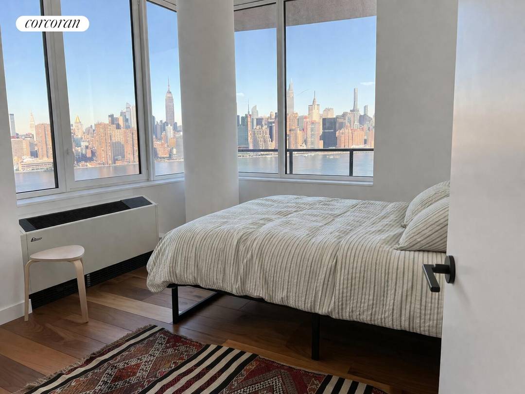 The East River and Manhattan skyline are yours, in one of Greenpoint's most luxurious buildings on prime waterfront.