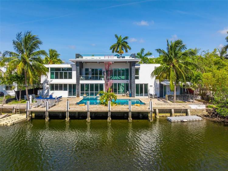 Discover luxury in this custom modern home on a premier Las Olas Isles street.