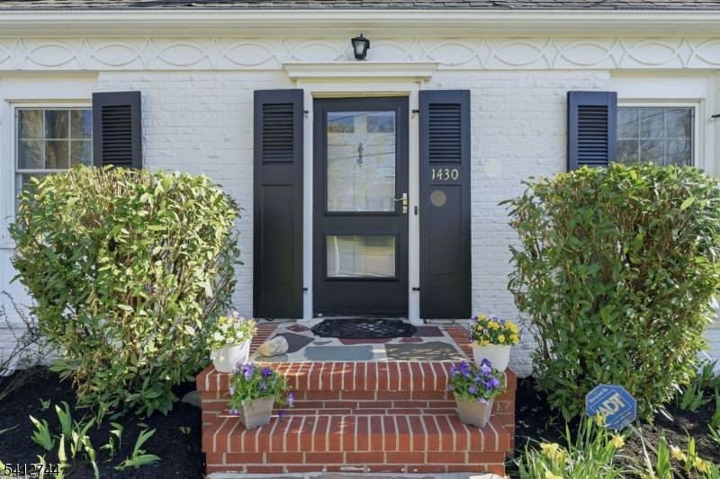 This inviting Colonial Cape offers classic charm from the start, with its brick front and staggered wooden shingles for maximum curb appeal.