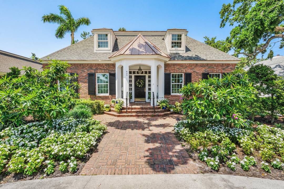 Welcome to Charleston Square, a charming enclave of just six homes nestled beneath majestic oaks, steps from Quail Valley Club.
