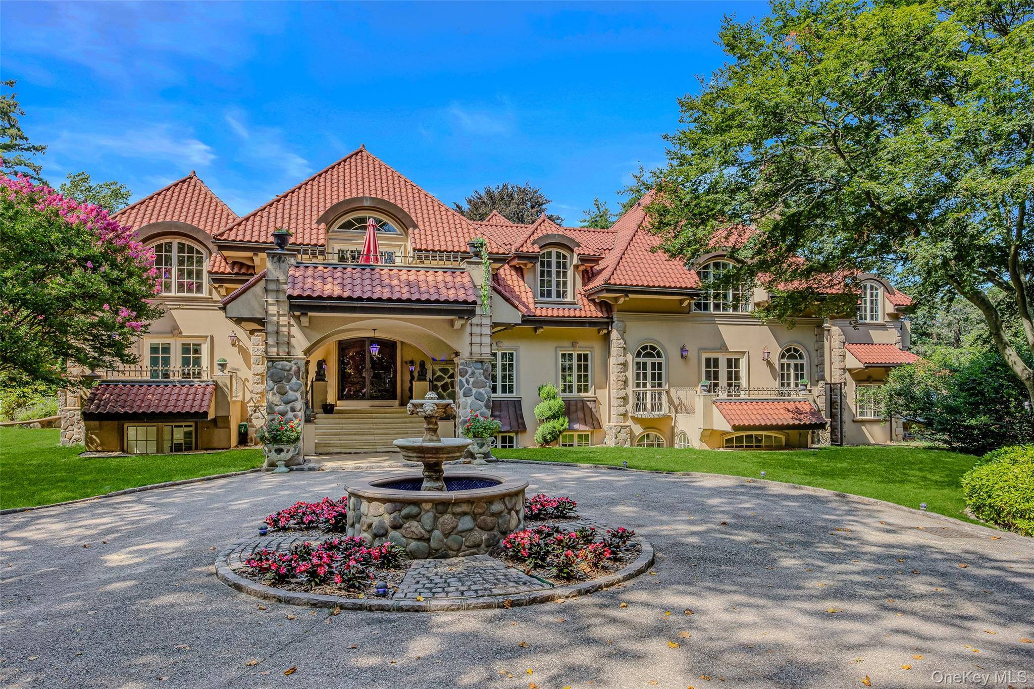 This exceptional Mediterranean inspired estate is nestled within the exclusive Village of Sands Point.
