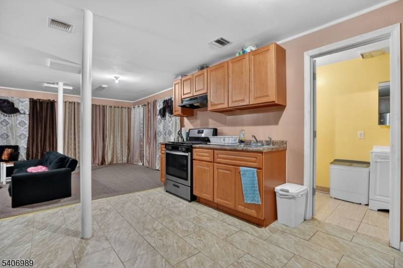 Three family residential property consisting of 8 bedrooms and 5 bathrooms.