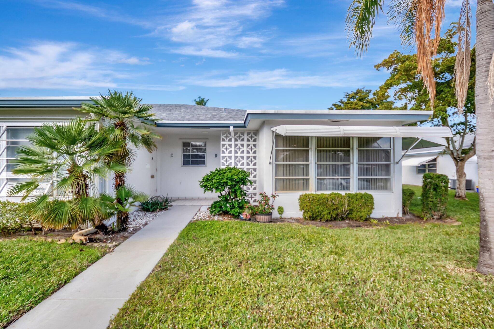 This charming 2 bedroom, 2 bathroom villa is filled with natural light and modern appeal.