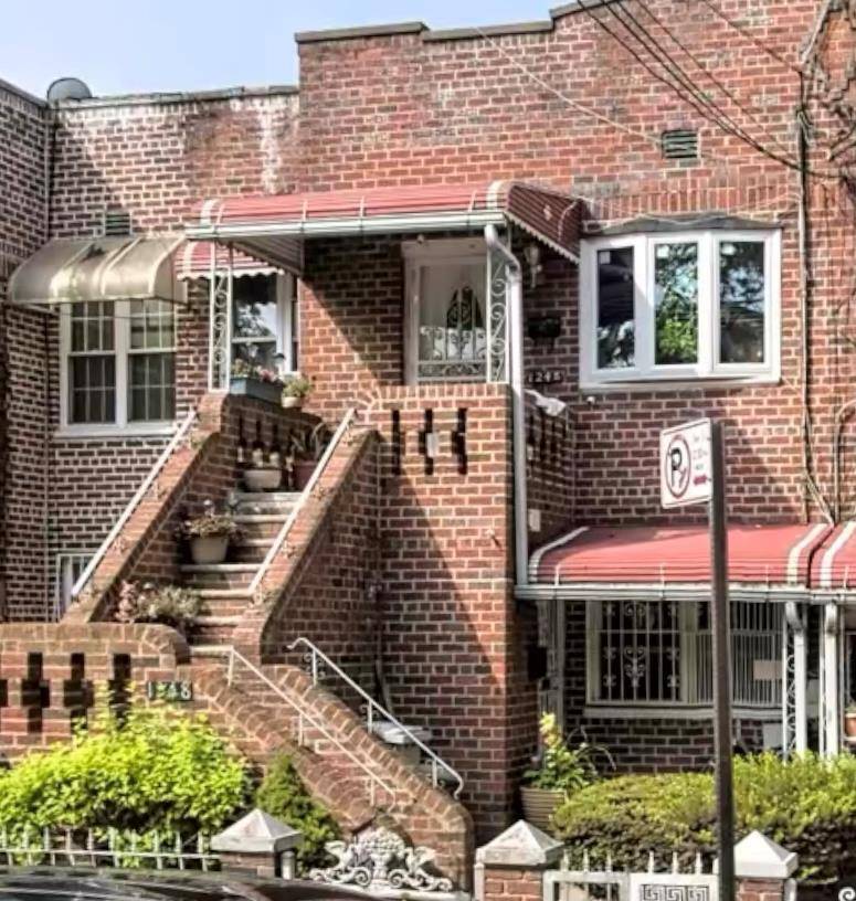 Nestled on a beautiful tree lined street in the heart of Canarsie, this attached two family brick home is a must see.