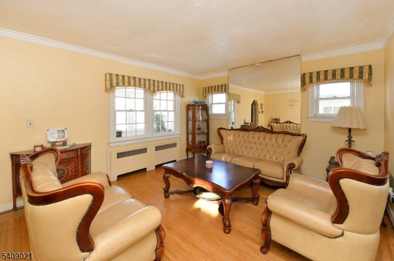 Bright Nice starter home located near shopping, schools, transportation, enclosed front porch, which is heated.