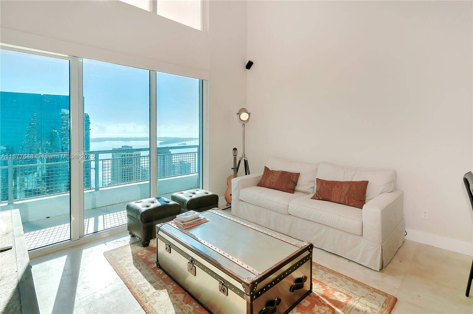 Stylish 2BD 2. 5BA loft with soaring double height ceilings, floor to ceiling windows, and private balcony with city views.