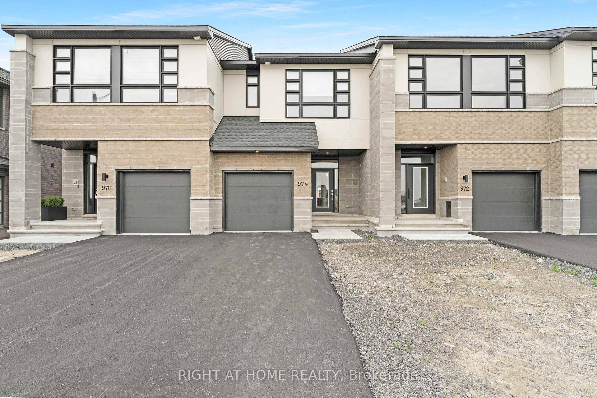 Welcome to 974 Acoustic Way, a stunning executive townhome nestled in the highly sought after Riverside South community.