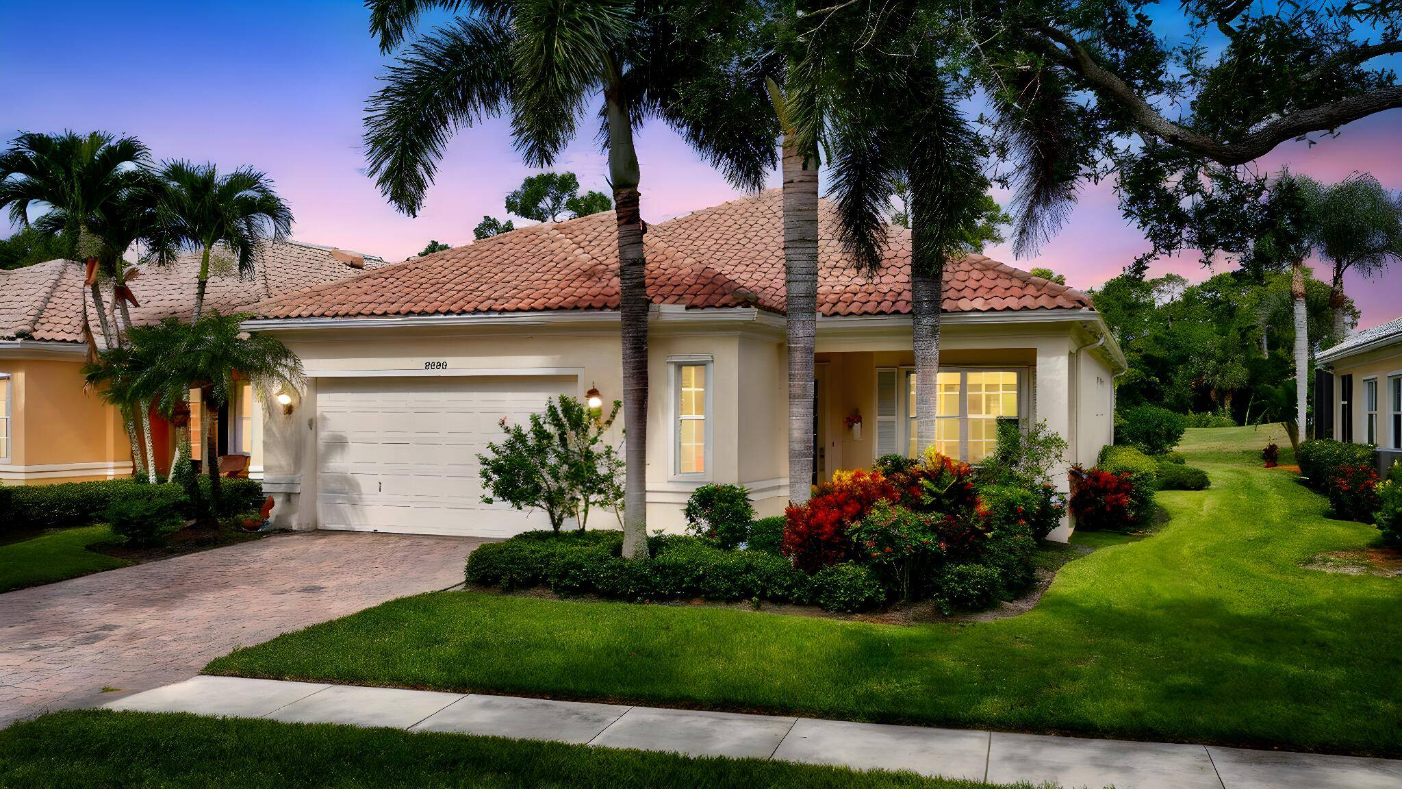 Exquisitely upgraded no detail overlooked including closet built ins, a motorized patio screen, extensive crown moldings, large base boards, and an epoxied garage floor.
