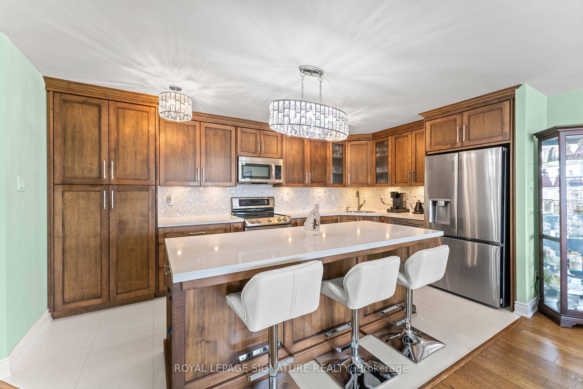 Stunning 2 Bedroom Condo with Designer Kitchen With Custom Built Ins And Huge Island.