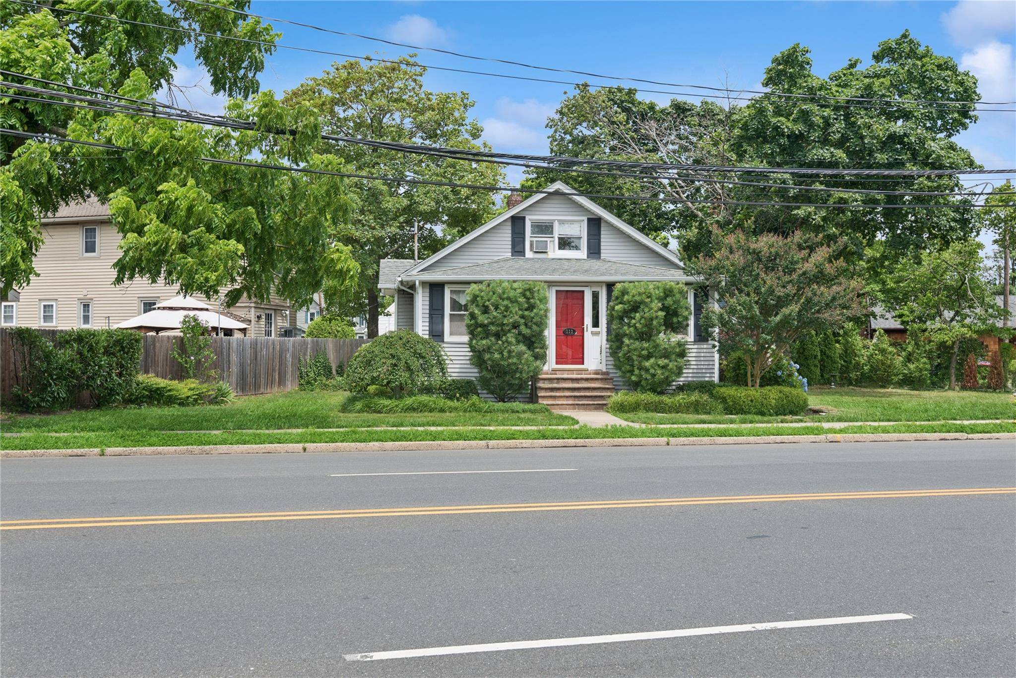 Charming 2 bedroom home with hardwood floors, updated eat in kitchen, formal dining room, and spacious living room with office nook.