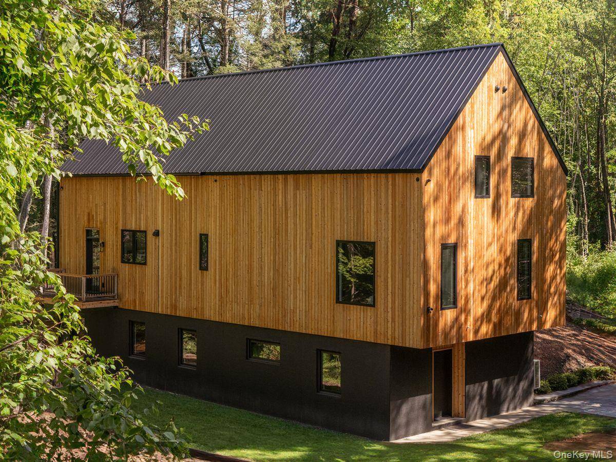 A stunning and private contemporary new build on 3 acres just minutes to Rhinebeck and Red Hook village.