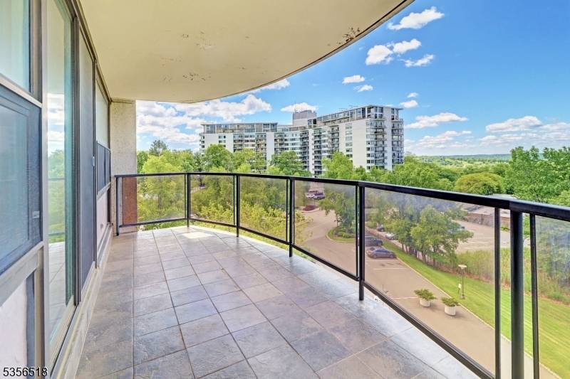 One to see Renovated 2 bed, 2 bath boasts modern upgrades Galley kitchen features rich, dark wood cabinetry, light granite countertops with a matching backsplash.