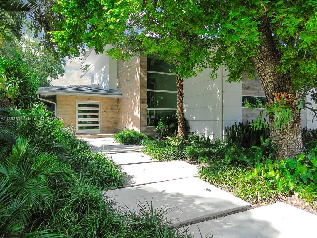 Enhance your life in the charming and serene North Coconut Grove s exclusive Bay Heights.