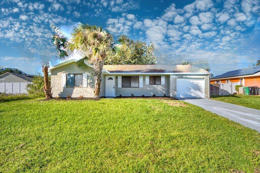 Beautifully renovated 2 bedroom, 1 bath home on a large lot with a one car garage.
