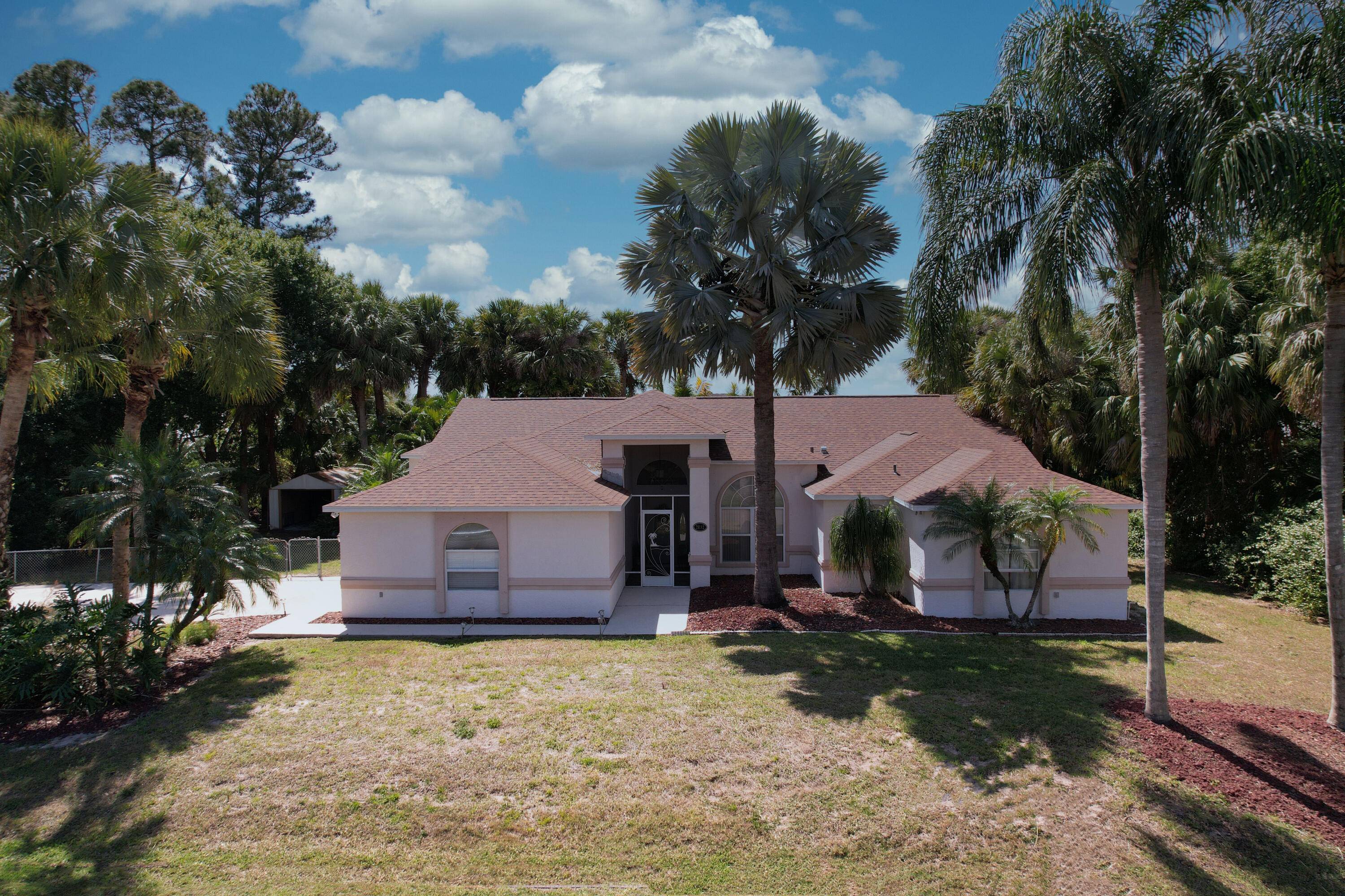 Delightful Florida lifestyle residence on 1 2 acre lot.