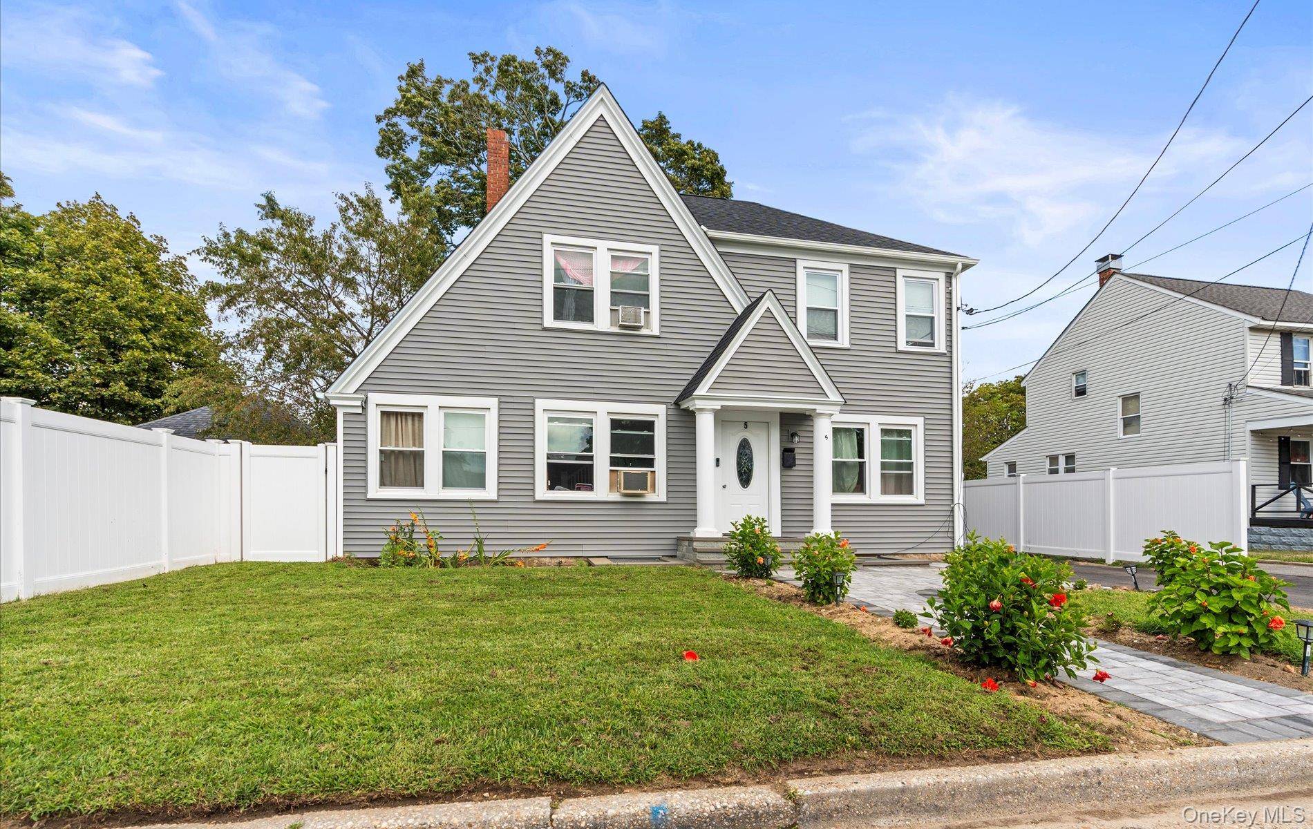 Welcome to this stunning residence WITH TONS OF UPDATES, that perfectly combines timeless charm with modern living, ideally located in the vibrant Patchogue Village.