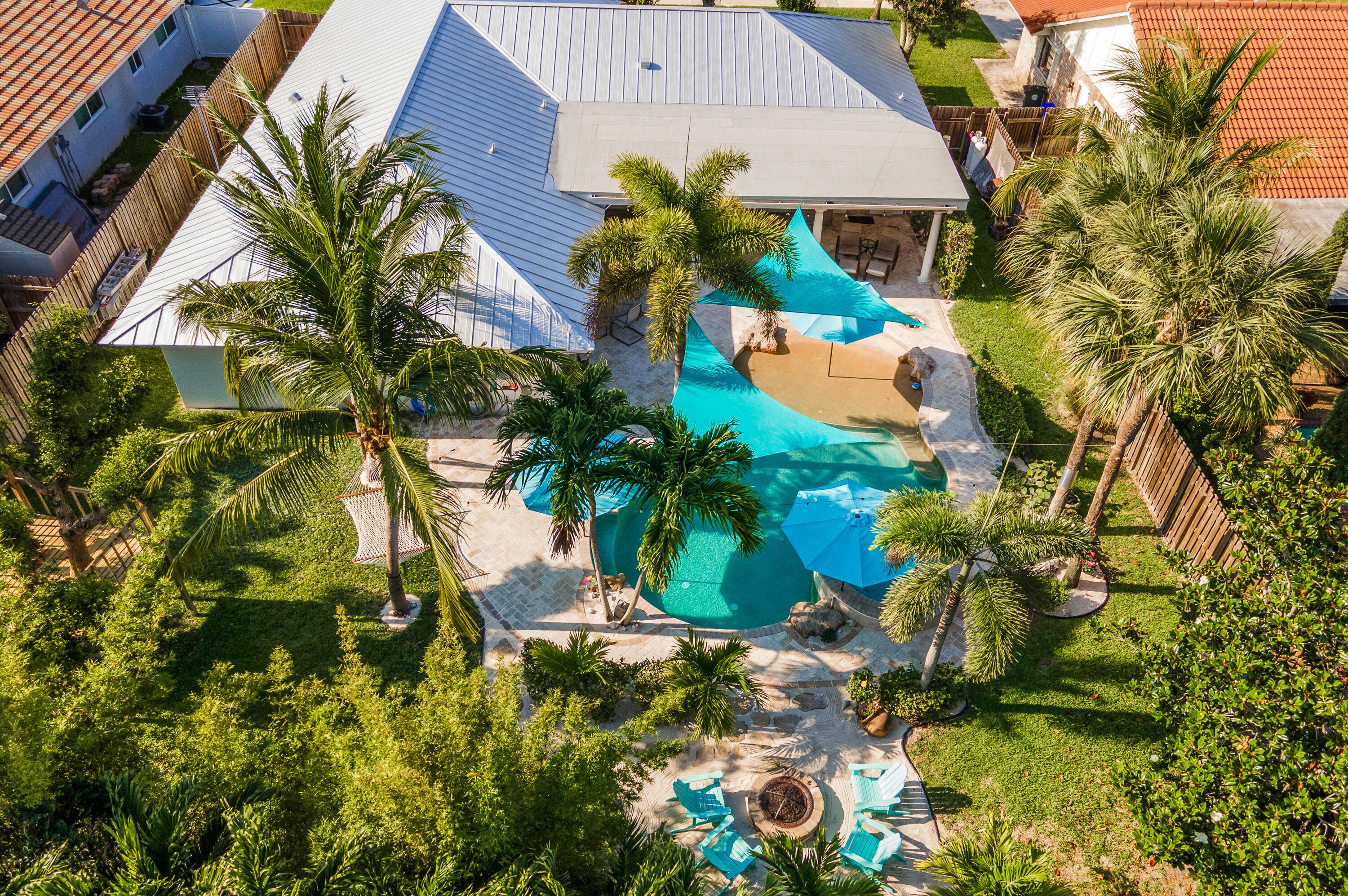 Turnkey and updated, this stunning home features a 2024 standing seam metal roof with 10 year transferable warranty, full impact windows and doors, remodeled baths, vaulted ceilings, crown molding, and ...