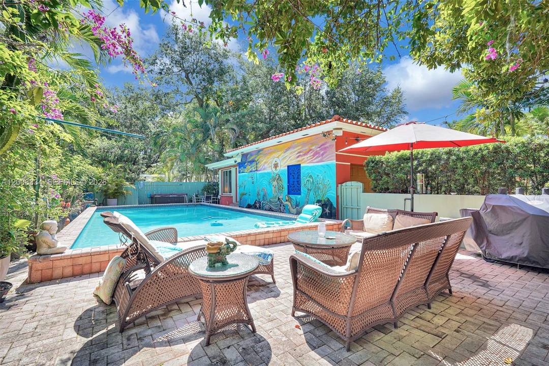 Discover the ultimate Mediterranean inspired, tropical oasis feel on the most coveted block of NE 5th Avenue in Miami Shores.