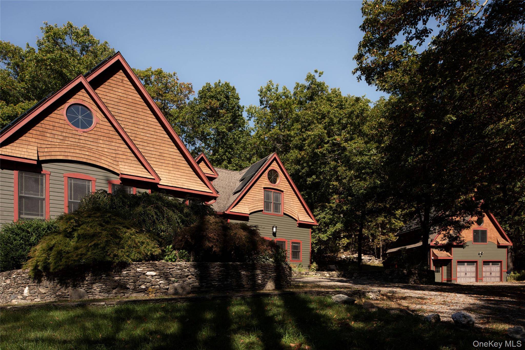 Set on a gentle rise along a quiet private road, minutes from Rhinebeck Village, this modern country compound offers nature, function, and flexibility in perfect balance.