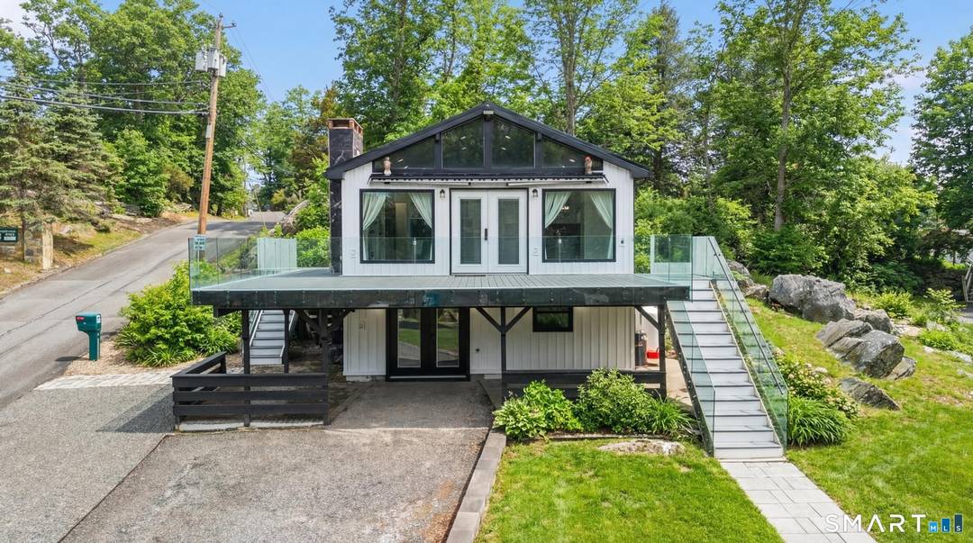 Modern, fully renovated retreat directly across from Candlewood Lake, steps away from Gerard's Marina.