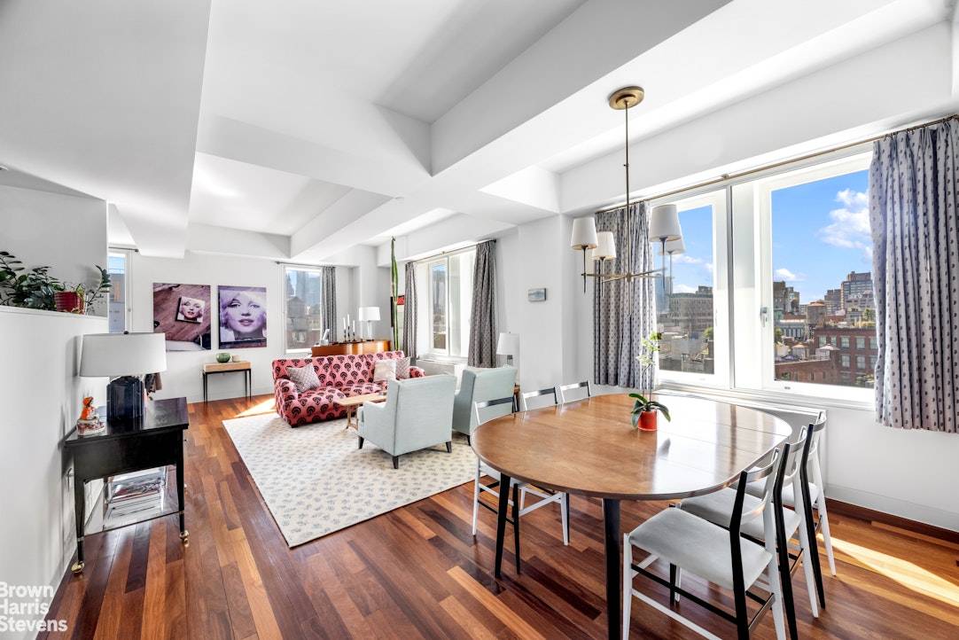 Apartment 10A is a spacious, 1, 735 square foot two bedroom pre war loft condominium featuring three full bathrooms and panoramic southwest views.