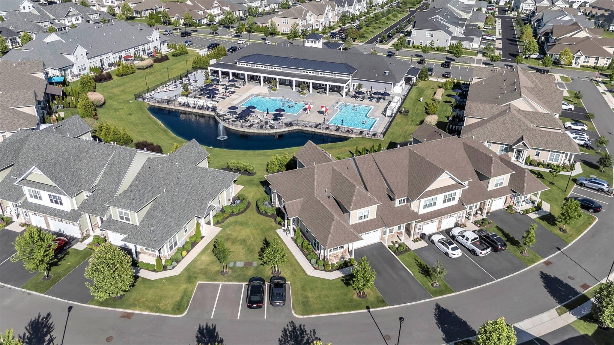 Welcome Home to this impeccably and stylishly designed 3 Bedroom, 2 1 2 Bath, Essex model End Unit, with views of the Pond, Fountain, Pools and Club House, located in ...