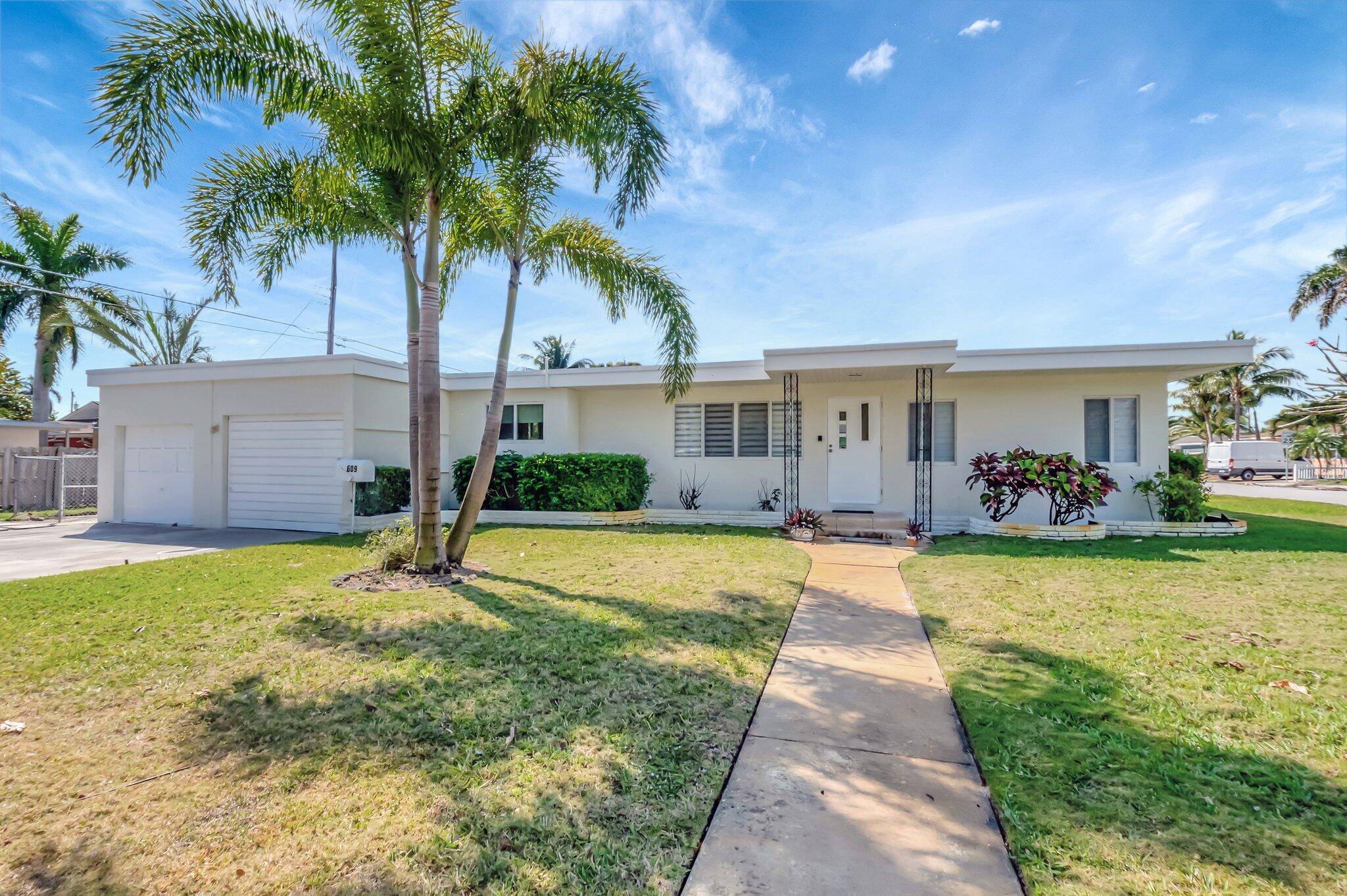 This unique property situated on a DOUBLE LOT offers dual income potential with both a charming main home and a separate mother in law suite.