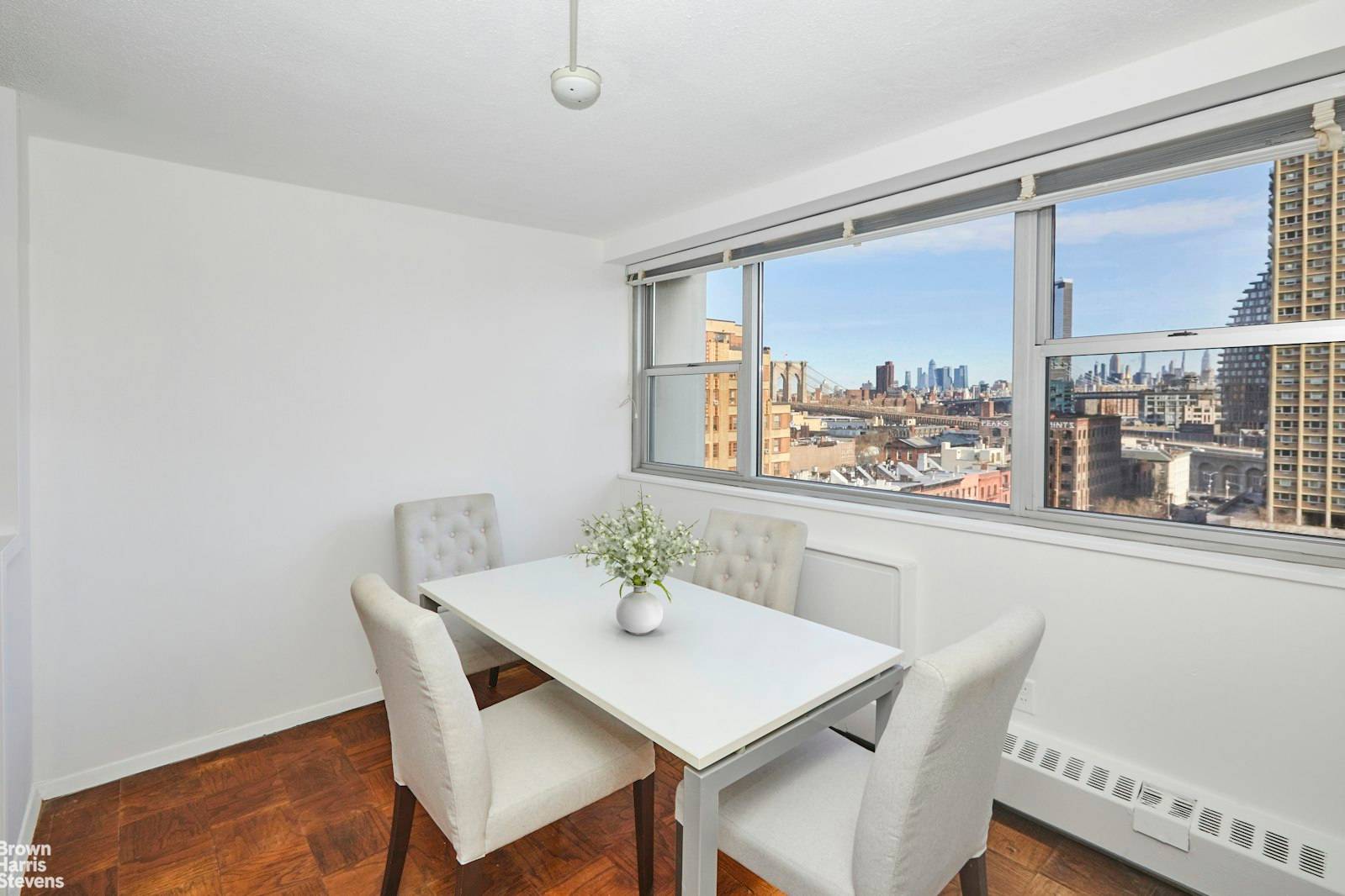 This charming alcove studio in Brooklyn Heights offers a unique blend of comfort and breathtaking views.