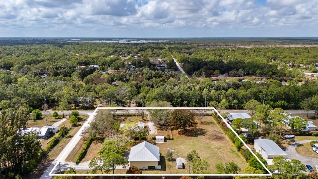 Set on 2. 5 fully fenced acres in Jupiter Farms, this versatile property features a 3BR 2BA main home and a substantial secondary structure ideal for additional living space, hobbies, ...