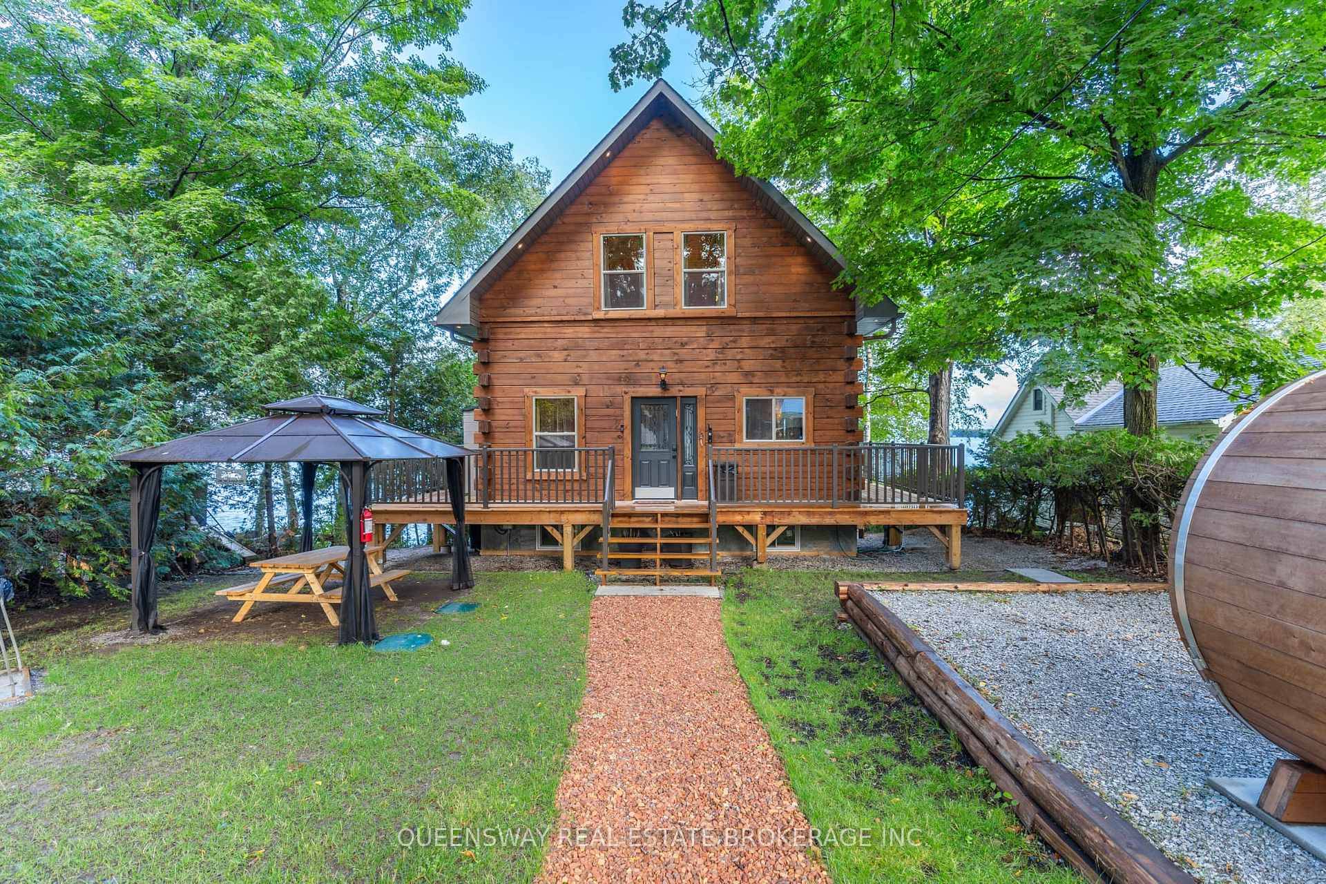 This stunning 2018 custom built Executive Log Cabin sits on a prime 50'x150' waterfront lot on Dalrymple Lake in the Kawarthas.