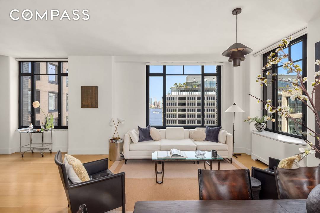 Residence 17E presents a refined two bedroom, two bathroom corner residence defined by volume, light, and exposure.