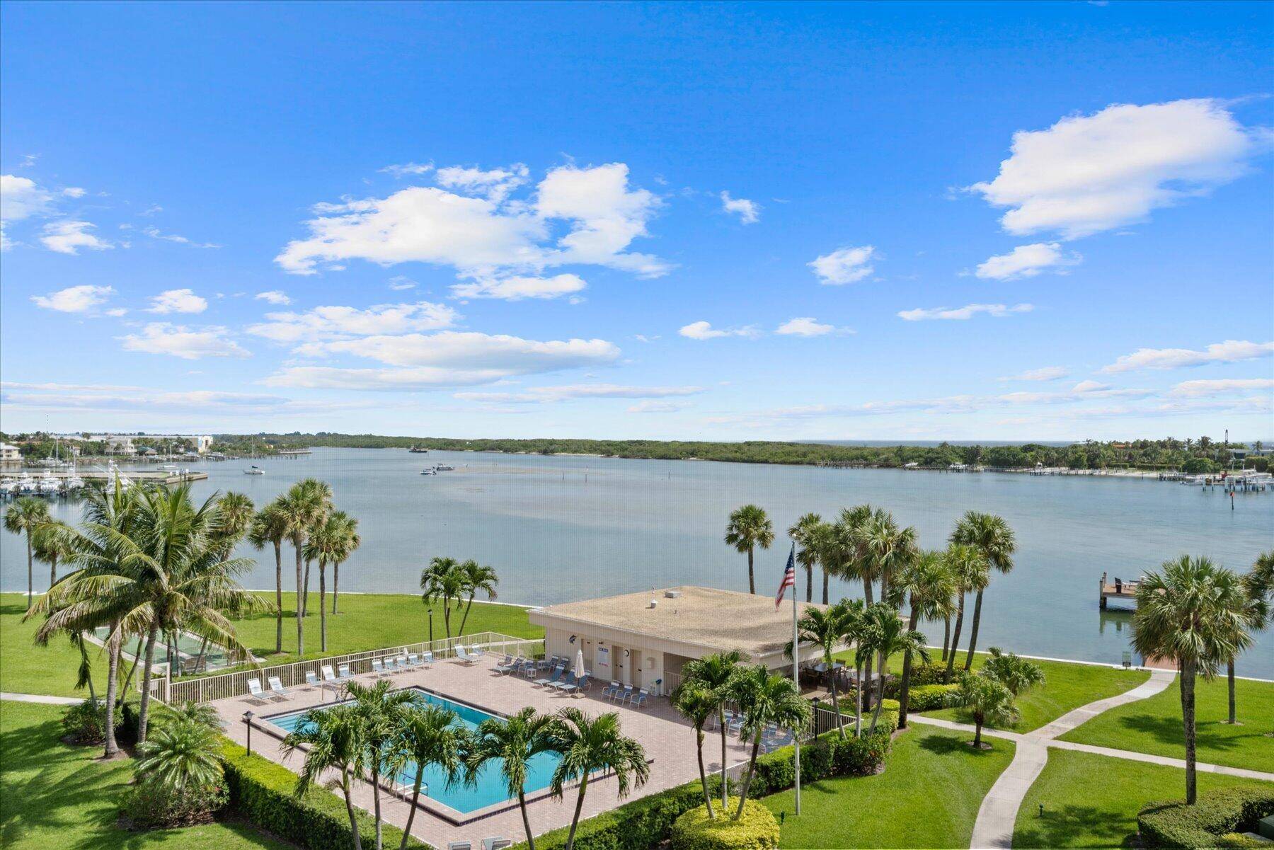 Spectacular end unit penthouse with long, panoramic views looking up the blue water of the Intracoastal and over at Blowing Rocks and the the Atlantic Ocean !