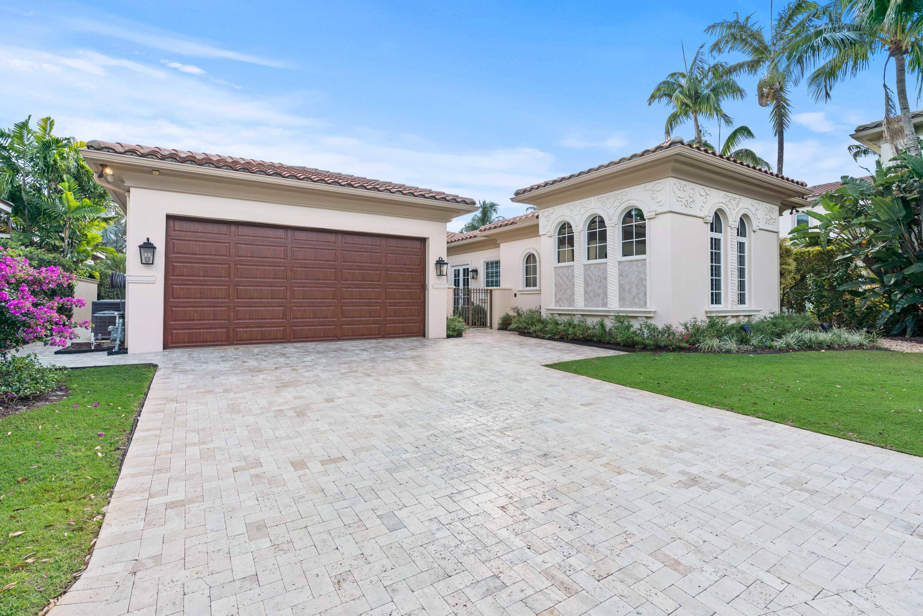 Welcome to 11216 Orange Hibiscus Lane, a meticulously updated and fully furnished residence with a NEW ROOF in the prestigious Old Palm Golf Club.