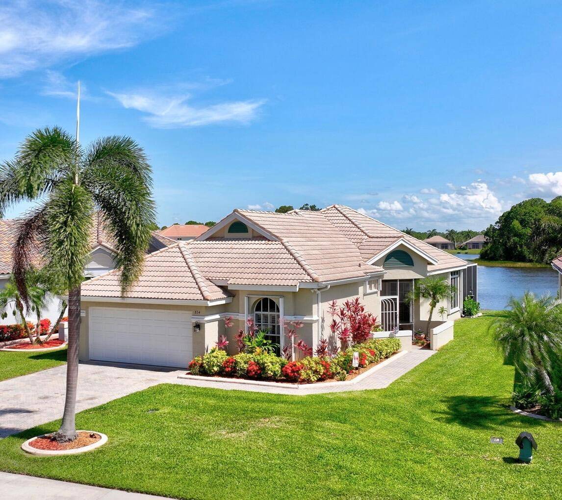 What a Gorgeous Water View from this completely remodeled home in the gated community of Lake Charles located in St Lucie West.