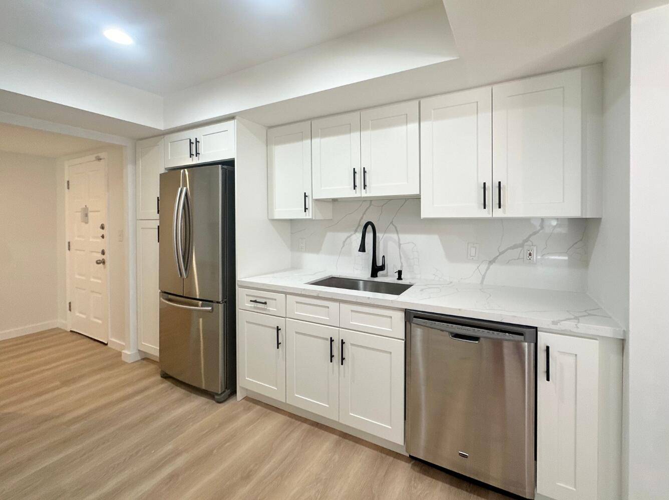 Stunningly renovated, 2 bedroom, 2 full bathroom, first floor corner unit with spacious screened wrap around patio with tons of natural light throughout !