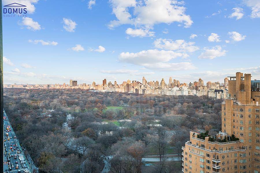 Magnificent 2 bedroom 2bathroom apartment, total renovation, top of the line appliances, spectacular panoramic Central Park views and Columbus Circle from the massive living dining room and master bedroom.