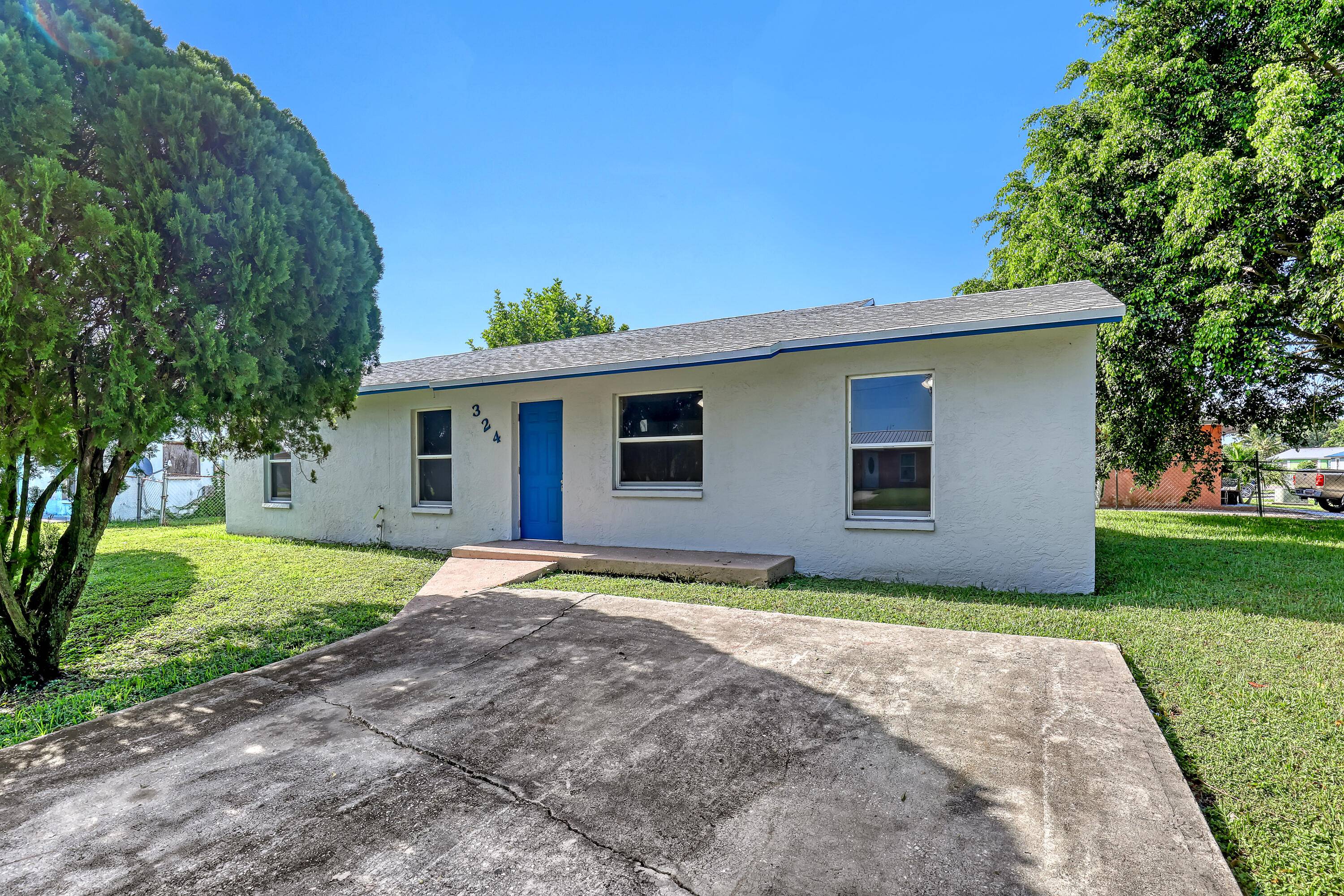 Stunning fully remodeled 4 bedroom, 2 bathroom home on a spacious corner lot in a quiet, well established neighborhood near Lake Okeechobee.